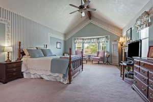 Bedroom featuring carpet flooring, ceiling fan, a textured ceiling, and wallpapered walls