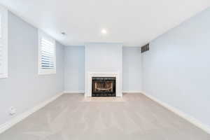 Large basement family room with gas fireplace
