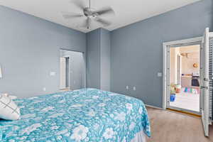 Bedroom with light wood-style floors and a ceiling fan