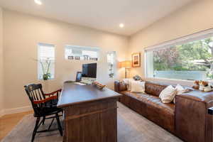 Office space featuring recessed lighting and light wood-style flooring