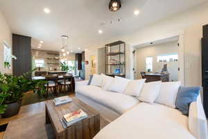 Living area featuring wood-type flooring and recessed lighting