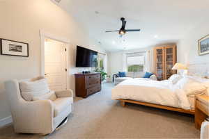 Bedroom with vaulted ceiling, light carpet, recessed lighting, and a ceiling fan