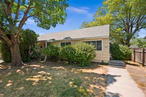 View of front of home featuring a shingled roof