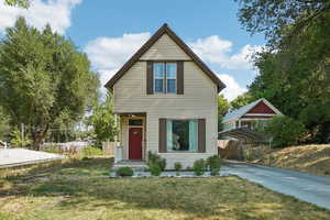 View of front of house with a detached carport and concrete driveway