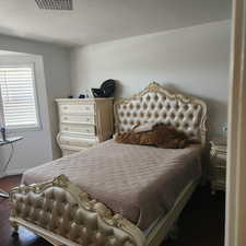 Bedroom with a textured ceiling