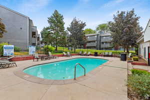 Community pool featuring a patio
