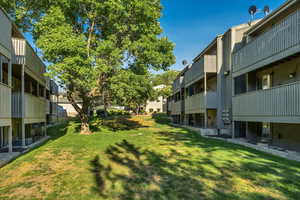 View of grassy yard with a residential view