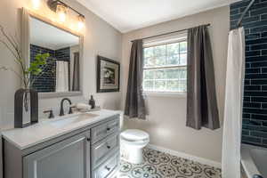 Bathroom featuring vanity and tile patterned flooring