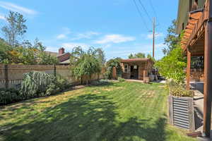View of fenced backyard