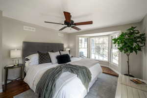 Bedroom with wood finished floors and ceiling fan