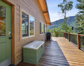 Deck featuring grilling area and a mountain view