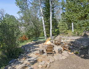 View of patio / terrace with an outdoor fire pit