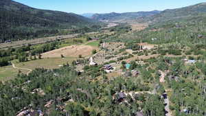 Aerial overview of property's location featuring a mountainous background