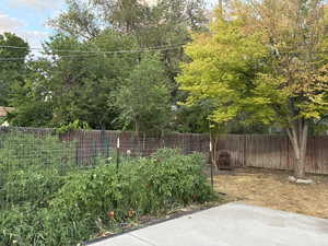 Fenced backyard with a patio area