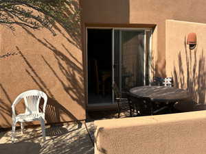 Rear view of house featuring a patio area and stucco siding