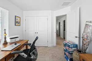 Office featuring light colored carpet