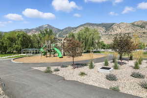Community playground featuring a mountain view