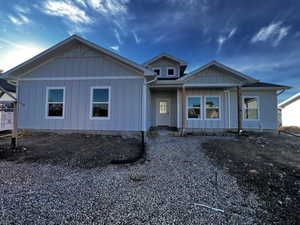 View of front of house with board and batten siding