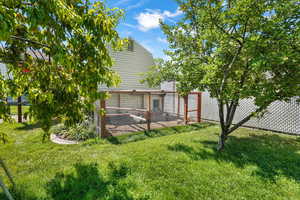 Back of property featuring exterior structure and an outdoor structure