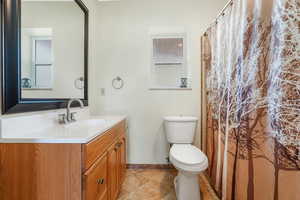 Bathroom with vanity and toilet