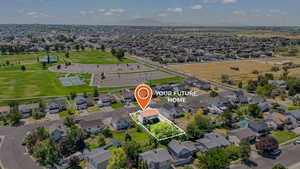 Aerial view of residential area with property parcel outlined