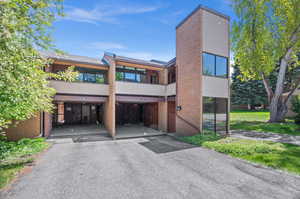 Contemporary house featuring brick siding