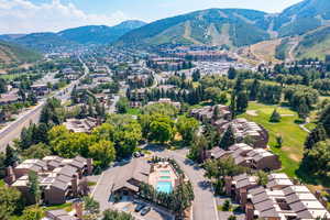 Aerial view of residential area featuring a mountainous background