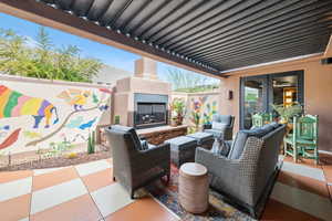 View of patio / terrace with an outdoor fireplace
