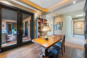 Home office with hardwood / wood-style flooring, french doors, and recessed lighting