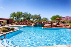 Community pool with a patio