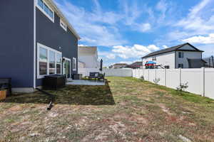 Fenced backyard with a patio area