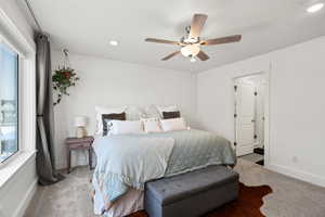 Primary suite with plenty of room for King size bed  Ceiling fan  Ceiling to floor curtains and black out shades