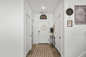 Large entry with 1/2 bath and Coat closet Light wood LVP