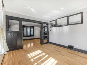 Unfurnished room with wood finished floors and recessed lighting