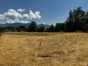 View of mountain backdrop with rural landscape