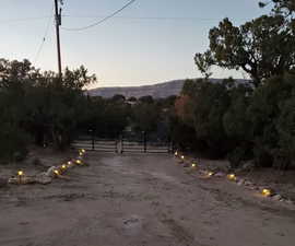 View of street featuring a gate and a gated entry