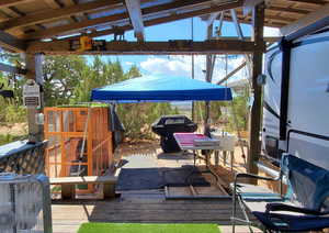 View of patio / terrace featuring a gazebo, area for grilling, and a wooden deck