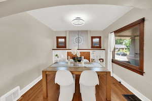 Dining space with baseboards and wood finished floors