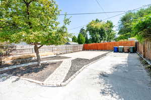 Fenced backyard with a patio area