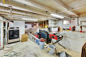 Below grade area featuring washer / dryer