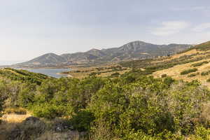 View of mountain background featuring a nearby body of water