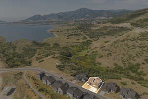 Aerial overview of property's location featuring a water and mountain view and property boundaries highlighted