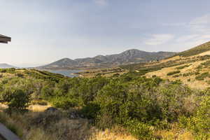 View of mountain backdrop featuring a large body of water