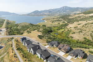 Aerial view of residential area featuring a water and mountain view