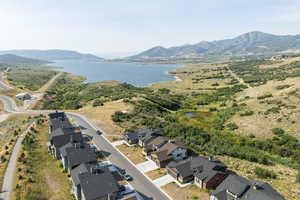 Aerial perspective of suburban area featuring a water and mountain view