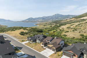 Aerial perspective of suburban area featuring a water and mountain view