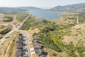 Aerial perspective of suburban area with a water and mountain view