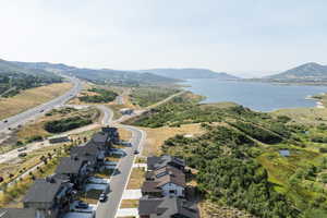 Aerial view of residential area featuring a water and mountain view