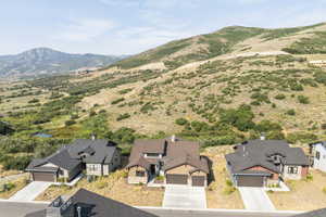 Aerial view of residential area featuring a mountainous background