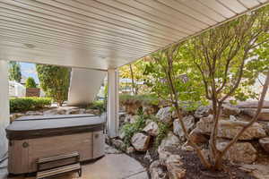 View of patio / terrace with a hot tub